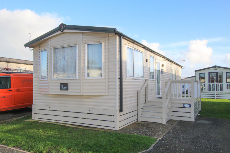 Victory Vision 2014 + decking at Pevensey Bay Holiday Park, East Sussex. 3 bedrooms / 6 berth