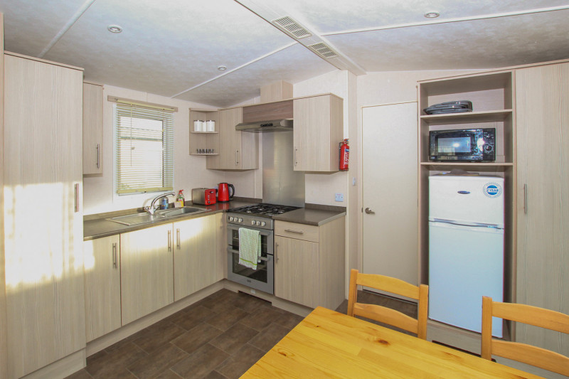 Victory Vision 2014 + decking at Pevensey Bay Holiday Park, East Sussex. 3 bedrooms / 6 berth