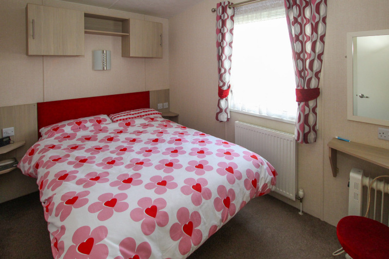 Victory Vision 2014 + decking at Pevensey Bay Holiday Park, East Sussex. 3 bedrooms / 6 berth