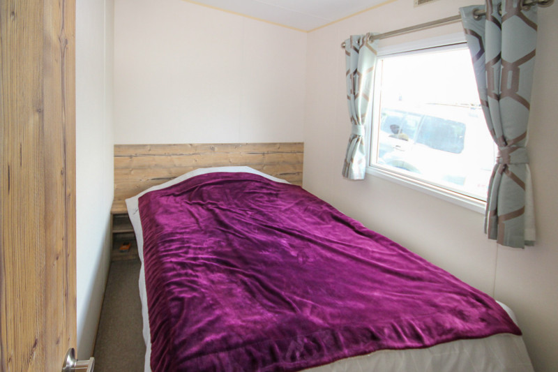 ABI Trieste 2017 static caravan sited at Allhallows, Kent. 3 bedrooms, DG/CH, decking