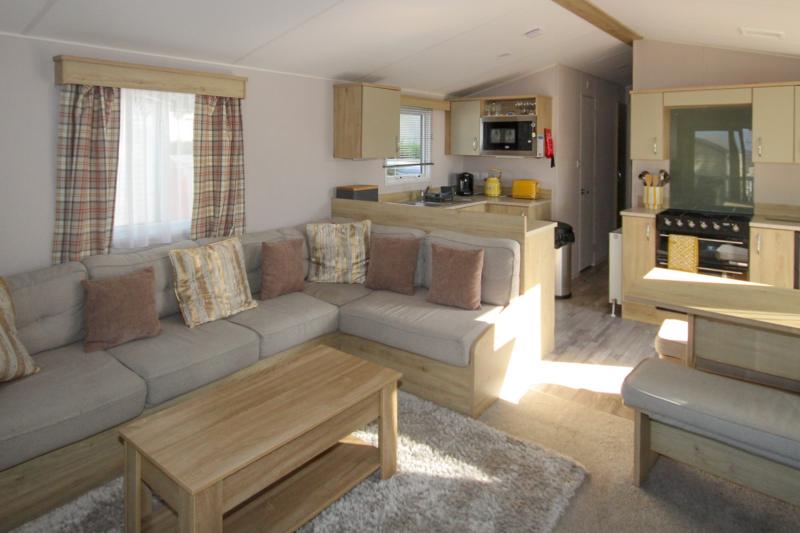 Atlas Mirage 2022 static caravan sited at Haven's Kent Coast Holiday Park, Allhallows. 2 bed, DG/CH, decking
