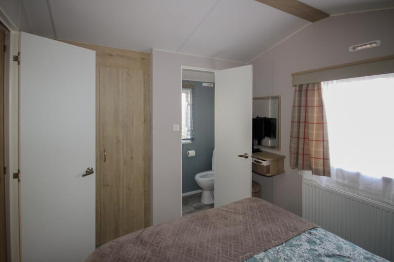 Atlas Mirage 2022 static caravan sited at Haven's Kent Coast Holiday Park, Allhallows. 2 bed, DG/CH, decking