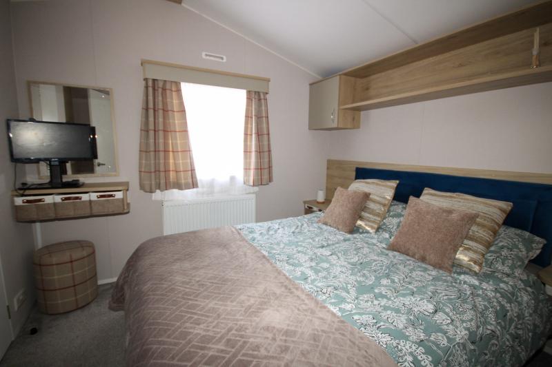 Atlas Mirage 2022 static caravan sited at Haven's Kent Coast Holiday Park, Allhallows. 2 bed, DG/CH, decking
