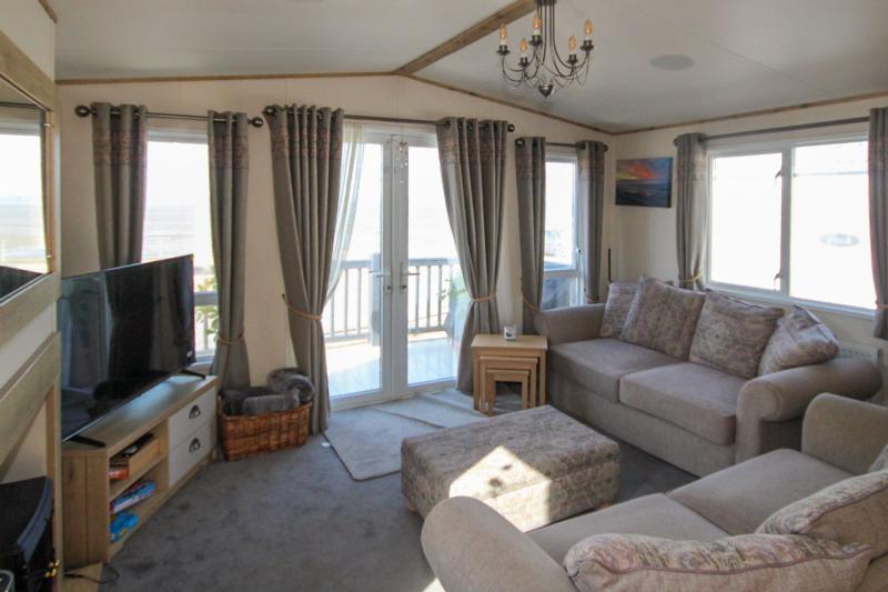 ABI Ambleside 2019 villa-style caravan on a front-row river-view pitch at Allhallows, Kent