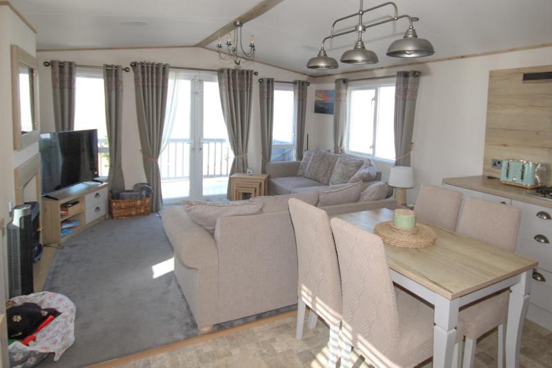 ABI Ambleside 2019 villa-style caravan on a front-row river-view pitch at Allhallows, Kent